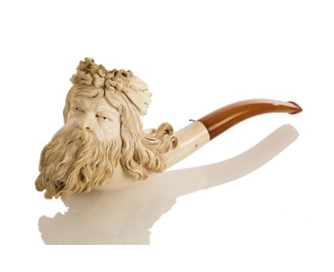 A MEERSCHAUM PIPE OF NEPTUNE, 19TH-CENTURY, depicted with flowing hair and beard, and wearing a seaweed crown, threaded amber