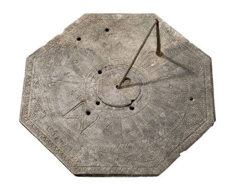 A FRENCH SLATE SUNDIAL, MID-17TH-CENTURY, the octagonal plate with decorative border, compass rose divided VIII-XII-IIII, wit