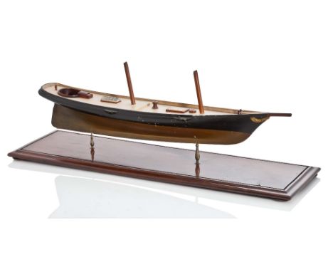 AN ATTRACTIVE UN-RIGGED MODEL OF THE FAMOUS RACING YACHT AMERICA (1851), POSSIBLY CIRCA 1901, the 25½in. hull carved from the