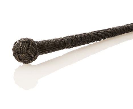AN EXCEPTIONAL SAILORS' KNOTWORK WALKING STICK, the plain tapering ebonised shaft covered in intricate knotwork devices which