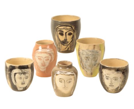 *SUSHILA SINGH (1904-1999): A group of six art pottery vases each decorated with a stylised female head, incised marks to the