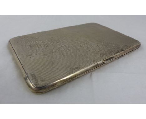 Hallmarked silver cigarette case, cartouche engraved E W P. Assay Birmingham 1932. 8 cm x 18 cms. Weight 205g.