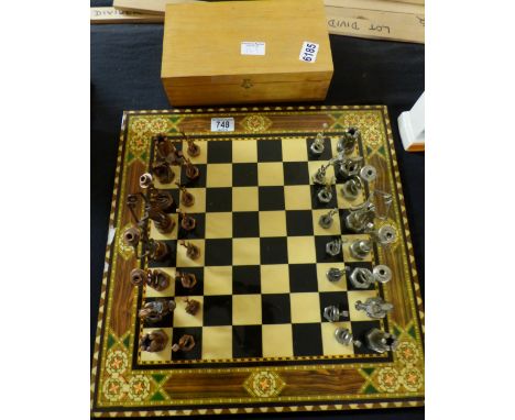 Chess pieces made from reclaimed nuts and bolts, boxed, and chess board