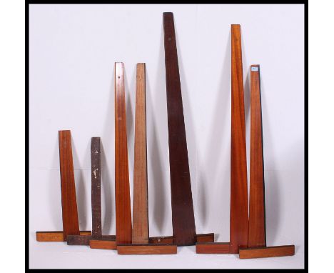 A collection of vintage draughtmans set squares, bearing different makers marks please see images
