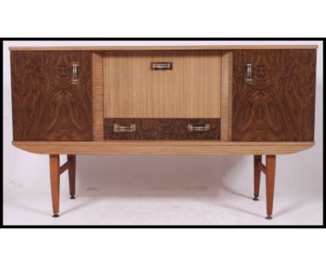 A retro / vintage veneer two-tone sideboard dresser with central drop down cupboard  and drawer and side cupboards.  Brass de