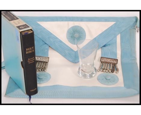 A collection of Masonic items to include sash along with Forest of Mendip club etched shot glass and a bible.