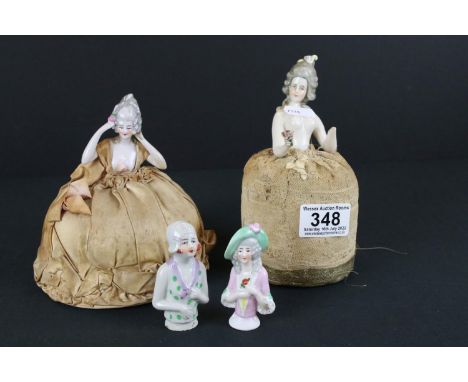 A collection of four antique ceramic pin cushion dolls.