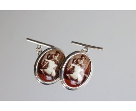 Pair of silver cufflinks with enamel panels depicting a nude female