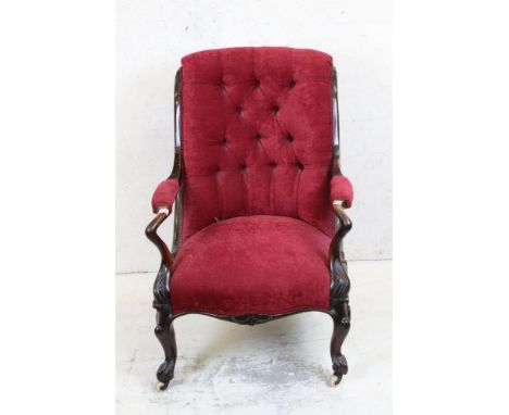 Victorian Salon Chair with carved walnut show-frame and red fabric button back upholstery raised on cabriole legs and ceramic