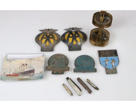 A small group of mixed collectables to include car mascot badges, white star line postcard, pocket knives and a brass compass