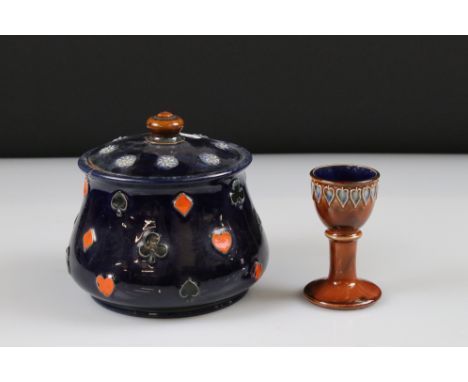 Doulton single egg cup, brown glaze with stylized leaf decoration &amp; a Doulton lidded jar with card suit decoration 