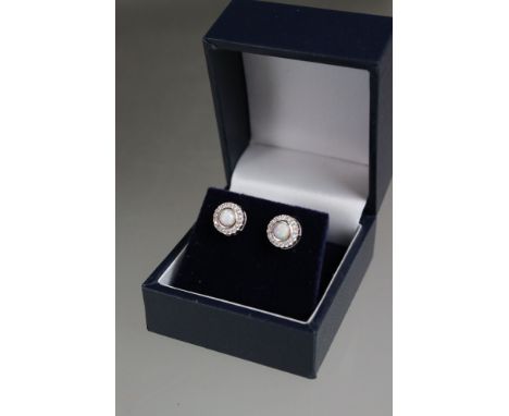 Cased pair of silver and CZ earrings with central opal panels 