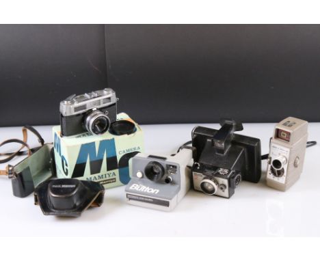 A small collection of vintage cameras to include Polaroid and Bell &amp; Howell examples. 