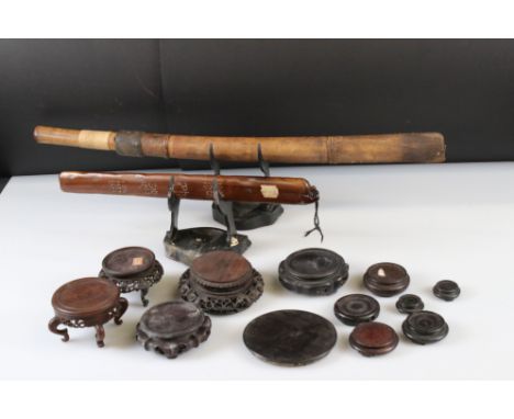 A collection of wooden Chinese stands together with a start sword and scabbard. 