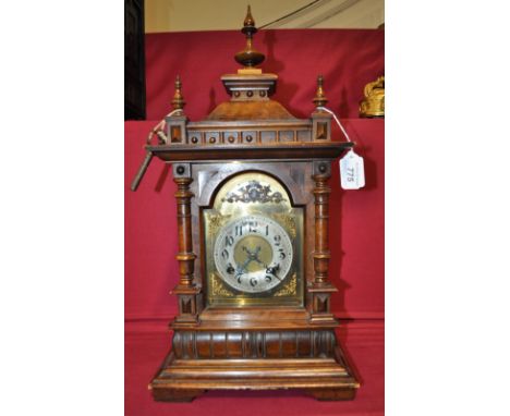 Carved walnut cased bracket clock,
brass dial and silver chapter ring, two train movement, ex-property of Major RM Cole, M.C.