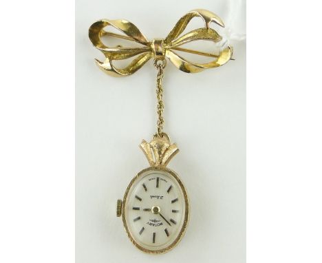 A 9ct gold cased Rotary pendant watch 
on gold ribbon bow.