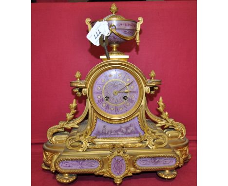 19th century continental ormolu mantel clock,
having a 2-train striking movement decorated with ceramic panels, height 14".