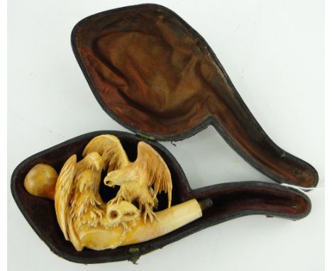 Intricately carved meerschaum pipe
depicting 2 eagles with a skull, length 3", in fitted case.