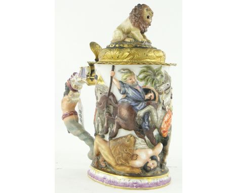 Naples porcelain tankard
with moulded and painted design depicting a lion hunting scene on horseback, with lion figure knop, 