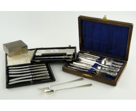 Group of silver items,
including silver pickle fork and spoon, cigarette box, paper knife and 2 case sets of silver handled c