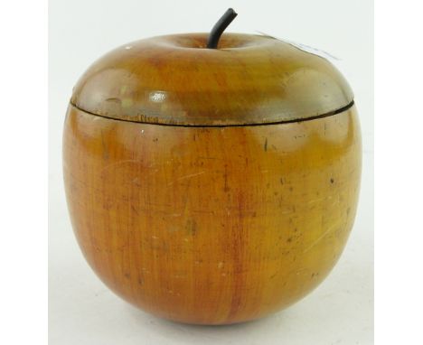 Antique turned and painted wooden caddy in the form of an apple,
4" diameter.