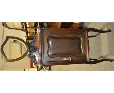 An Art Nouveau mahogany shaving cabinet,
with shield shaped mirror, tile top and panelled door under on cabriole legs, height