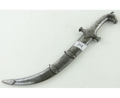 An Eastern dagger in scabbard,
with silver inlaid decoration, length 16".