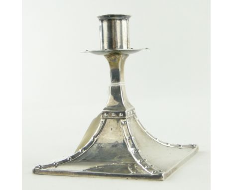 An Edwardian Arts & Crafts silver candlestick,
makers marks R S W S, retailers Sorley of Glasgow, height 11cm.