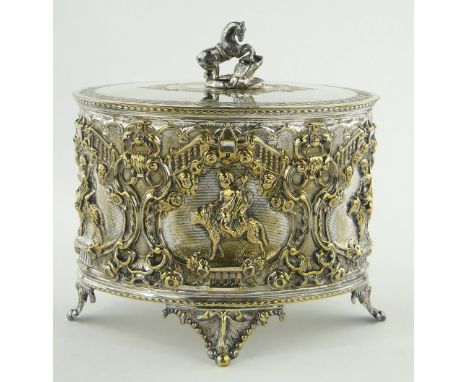 An ornate Victorian electroplate biscuit barrel,
with relief decorated surround, length 20cm.