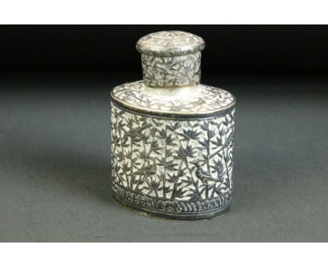 20th Century Chinese white metal tea caddy of oval form having moulded detailing to the sides featuring birds and bamboo with