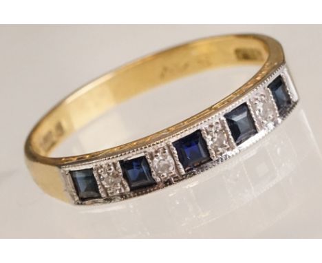 Sapphire and diamond 18ct yellow and white gold ring, five square step cut sapphires alternate set with four small eight cut 