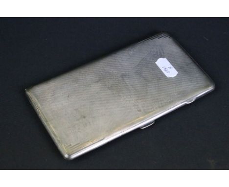 Art Deco silver cigarette case of rectangular form, with double-sided engine turned decoration, inscription to gilt interior,
