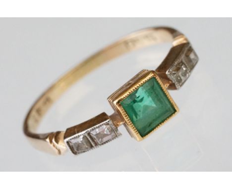 Early 20th century emerald and diamond 18ct yellow gold and platinum set ring, the centre square step cut emerald measuring a