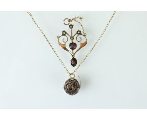 Early 20th century garnet and seed pearl 9ct rose gold pendant, together with a 9ct yellow gold chain with white metal pendan