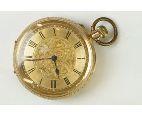 Early 20th Century 14ct gold open face pocket watch. The watch having roman numerals to the chapter ring with a central folia