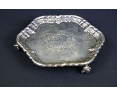 William Hutton &amp; Sons silver salver having a moulded rim with engraved crest raised on scrolled feet. Hallmarked London 1