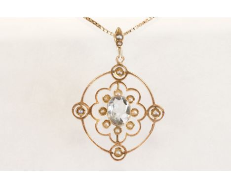 Early 20th century aquamarine and seed pearl 9ct yellow gold pendant, the openwork design with oval mixed cut aquamarine to t
