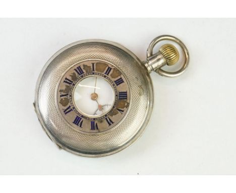 Silver half hunter top wind pocket watch, white enamel dial and seconds dial, black Roman numerals, poker hands, engine turne