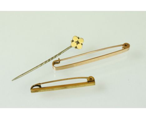 15ct gold bar brooch; a yellow metal bar brooch and a diamond 15ct gold head stick pin (3) 