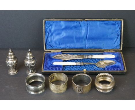 Pair of Edwardian silver pepperettes, makers Edward Barnard &amp; Sons Ltd, London 1907; five silver napkin rings, and a moth