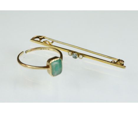 Edwardian aquamarine and seed pearl 9ct yellow gold bar brooch, (steel pin); together with a paste unmarked yellow gold ring 