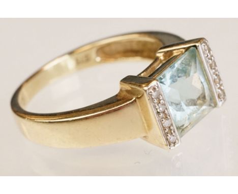 Topaz and diamond 9ct yellow gold ring, the square mixed cut topaz measuring approx 7.5mm x 8mm, partial rubover flush set, f