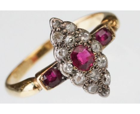 Ruby and diamond 18ct yellow gold marquise ring, three oval mixed cut rubies, fourteen small round eight cut diamonds, length