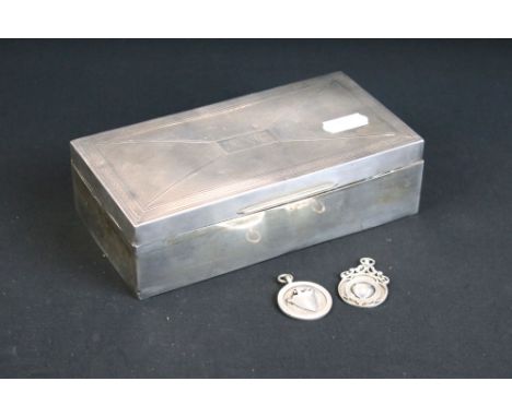 1930s silver hallmarked cigarette box having panelled engine turned detailing and a wooden lined interior, together with two 
