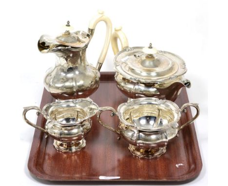 A four-piece silver and ivory handled teaset, by Walker & Hall, Sheffield, 1938/39, comprising teapot, hotwater pot, sucrier 