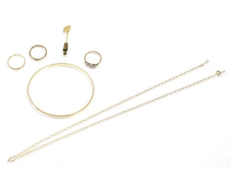 A 9 carat gold diamond ring; two 9 carat gold rings; a bangle; a fine chain and a stick pin 