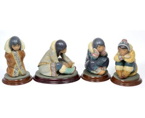 Four Lladro Eskimo figures (one damaged) 
