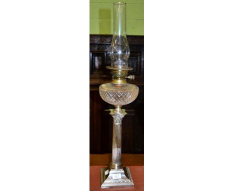 A silver plated Corinthian column oil lamp by Hawksworth Eyre & Co