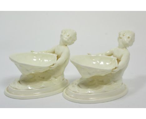 A pair of Royal Worcester merman form salts 