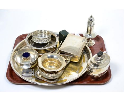 A group of silver comprising sugar caster, tea caddy, two small bowls and a cigarette box; together with a small group of sil